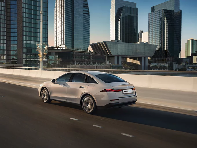 Rear view of the all-new MG 8 PHEV showcasing connected LED tail lamps and streamlined profile.