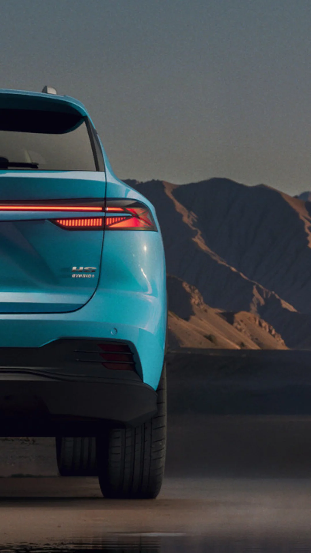 Rear view of Light Blue MG HS Hybrid+ with LED taillights and regenerative braking technology illustration