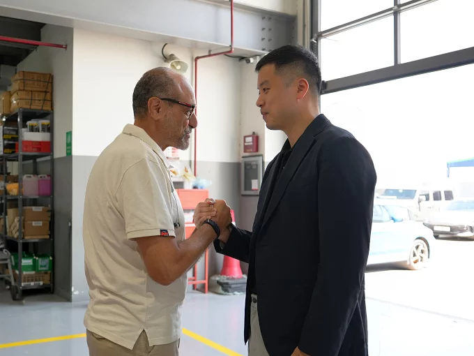 Managing Director greeting a service team member